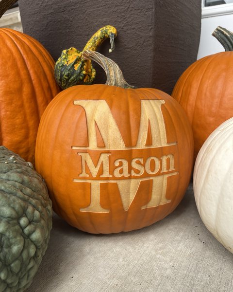 Mason, engraved in a split-letter monogram beside the door