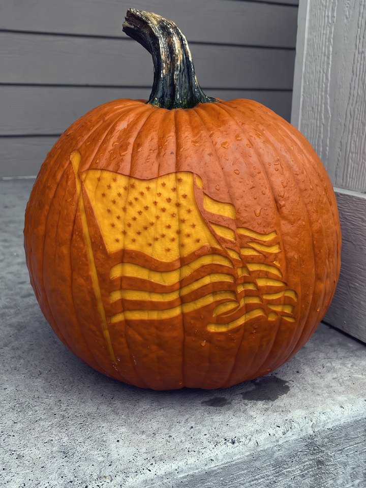 A pumpkin laser-engraved with a detailed American flag